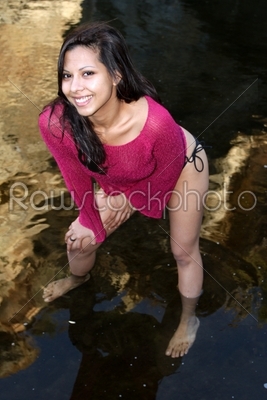 Young Hispanic Woman In Creek