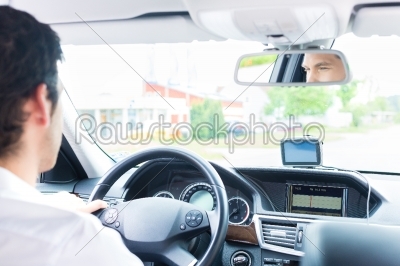 Young Taxi driver driving his car
