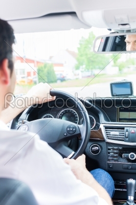 Young Taxi driver driving his car