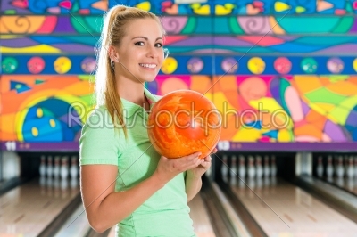 Young woman bowling having fun