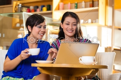 Young women in an Asian coffeeshop