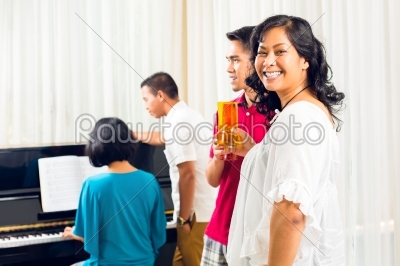 stock photo: asian people sitting together at the piano-Raw Stock Photo ID: 43437