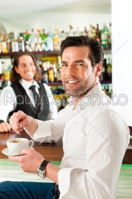 stock photo: barista with client in his cafe or coffeeshop-Raw Stock Photo ID: 44409