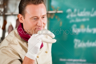 stock photo: butcher smelling fresh sausages-Raw Stock Photo ID: 41899