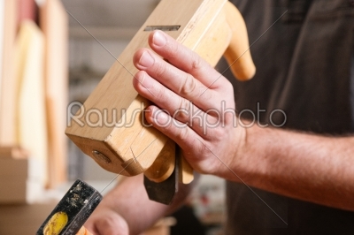 stock photo: carpenter working with a planer in his workshop close up on the tool with hands-Raw Stock Photo ID: 39447