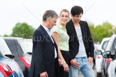 stock photo: couple looking at car on yard of dealer-Raw Stock Photo ID: 45049