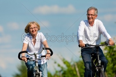 stock photo: happy couple cycling outdoors in summer-Raw Stock Photo ID: 42209