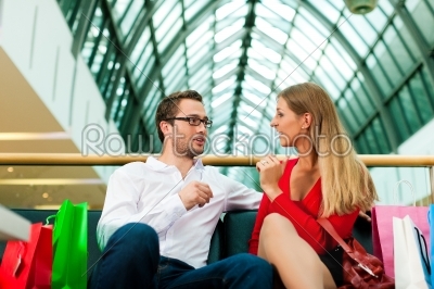 stock photo: man and woman in shopping mall with bags-Raw Stock Photo ID: 40227