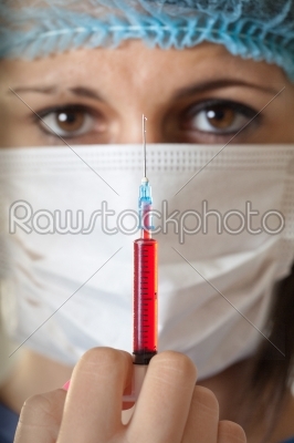  female doctor using a syringe