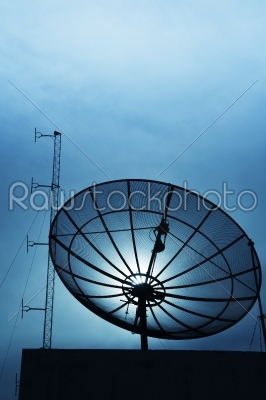  satelite dish beside FM boardcast antenna blue