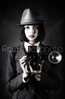  young woman and retro camera