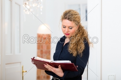 After Hour - woman at home with address book