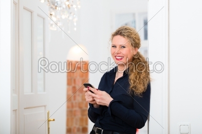 After Hour - woman at home with cell phone