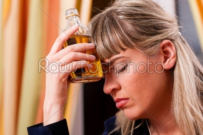 Alcohol abuse - woman drinking too much brandy
