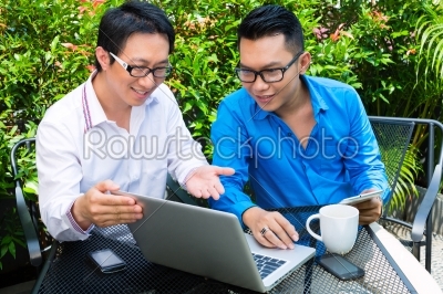 Asian Businessmen working outdoor