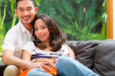 Asian couple on the sofa