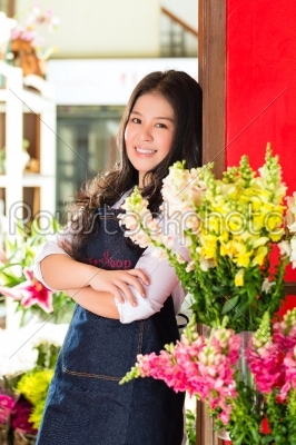 Asian Saleswoman in a flower shop