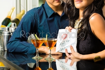 Asian woman seduces the man in restaurant