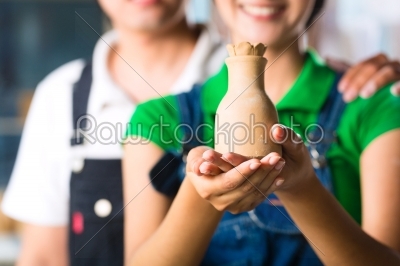 Asians with handmade pottery