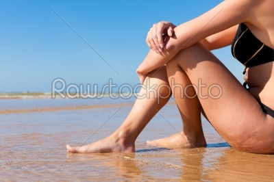 Attractive Woman in monokini on beach
