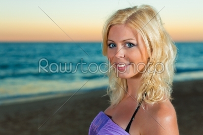 Attractive woman in the evening at sea