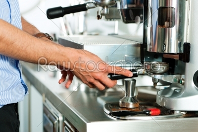 Barista prepares espresso