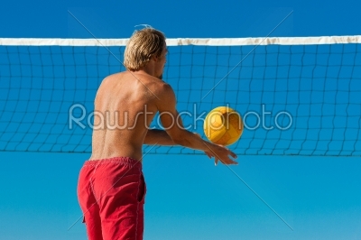 Beach volleyball - man serving the ball