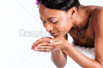 Beautiful African woman in Studio with fresh water