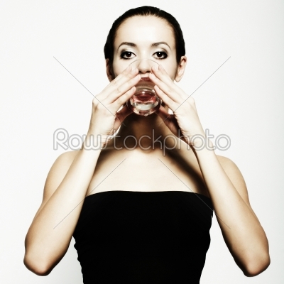 Beautiful girl drinks water