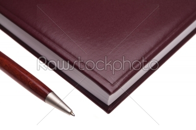 black leather notebook and pen