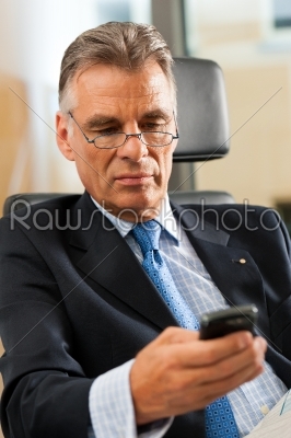 Boss in his office checking emails