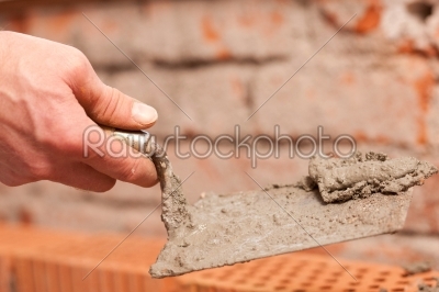 Bricklayer working on construction site