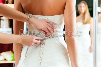 Bride at the clothes shop for wedding dresses