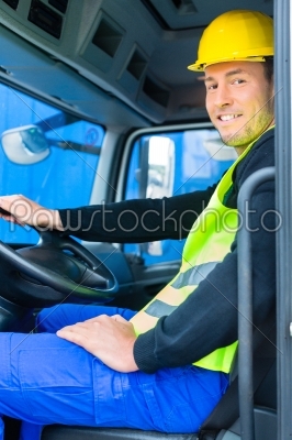 builder driving with truck of construction site