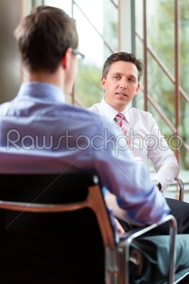 Business - young man and CEO in job interview