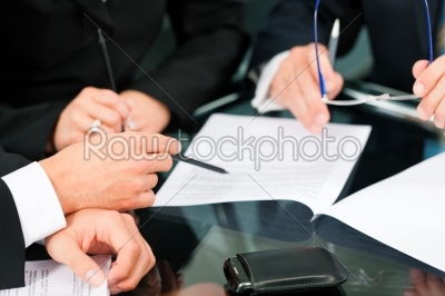 Business meeting with work on contract