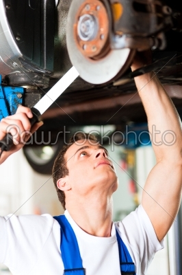 Car mechanic in workshop