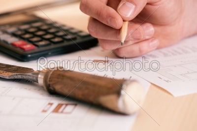 Carpenter planning his work 