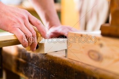 Carpenter with workpiece in carpentry