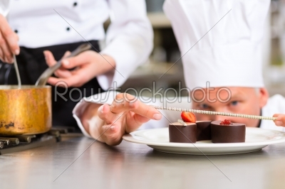 Chef as Patissier cooking in Restaurant dessert
