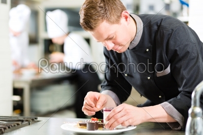 Chef as Patissier cooking in Restaurant dessert
