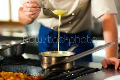 Chef in a restaurant or hotel kitchen cooking