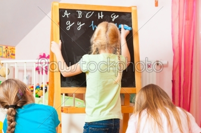 Children playing school at home
