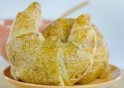 close up croissants on dish