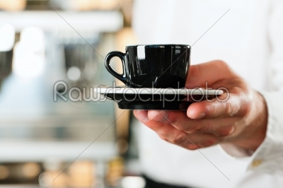 Coffeeshop - barista presents coffee or cappuccino