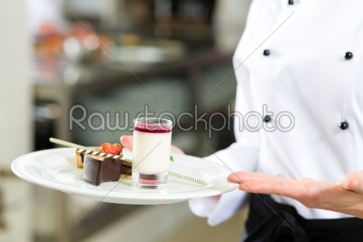 Cook, pastry chef, in hotel or restaurant kitchen