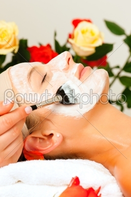 Cosmetics and Beauty - applying facial mask