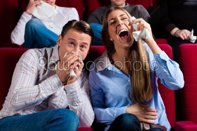 Couple and other people in cinema