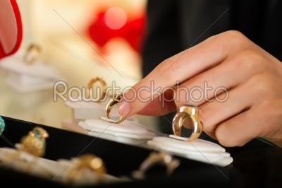 Couple choosing a ring at the jeweller