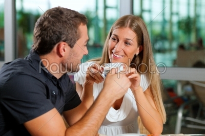 Couple drinking coffee in cafe